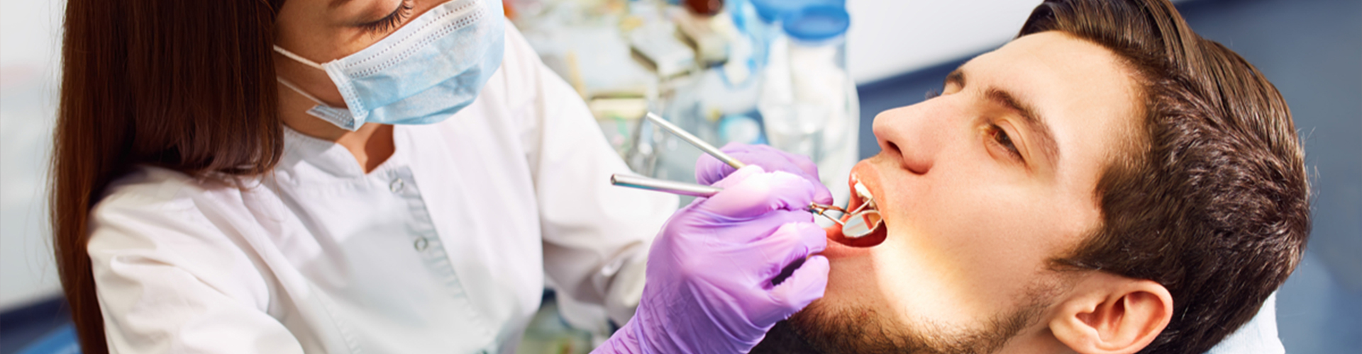 man getting dental exam from dentist