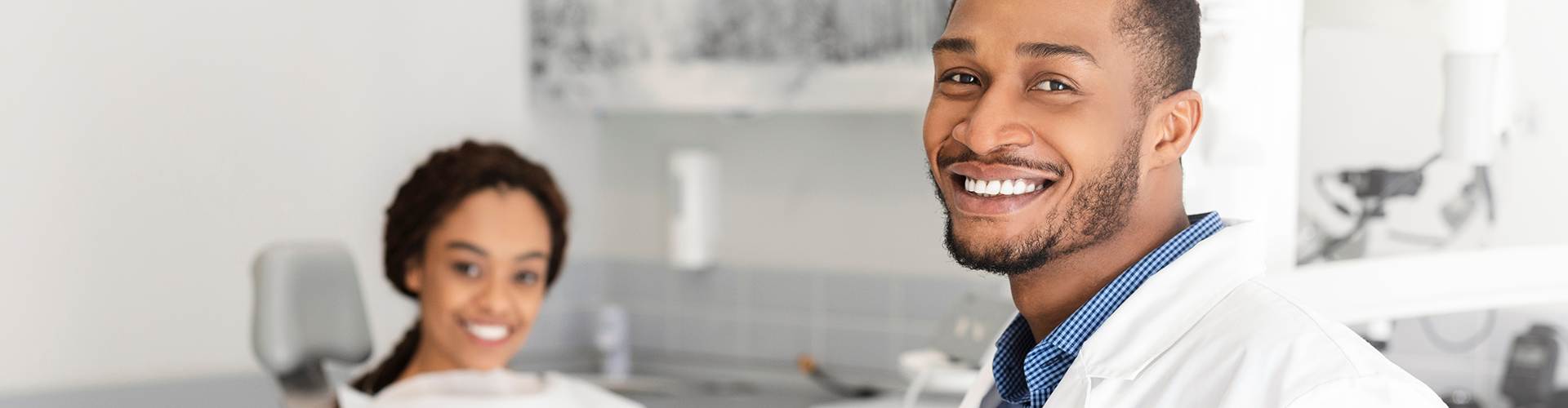 dentist and patient smiling