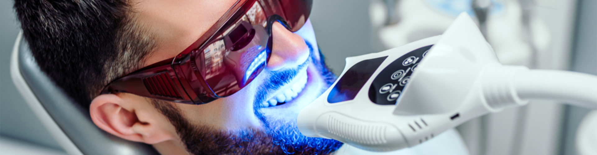 Man getting his teeth whitened.