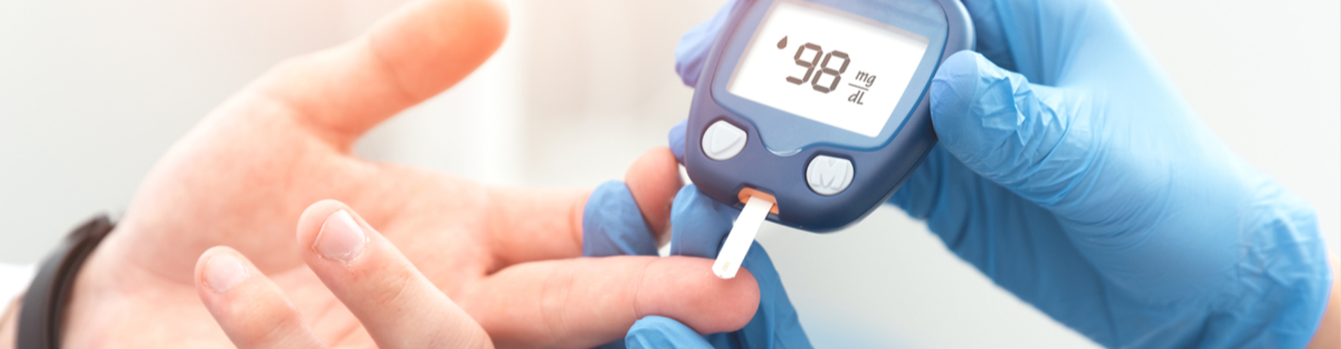 Person checking their blood sugar.