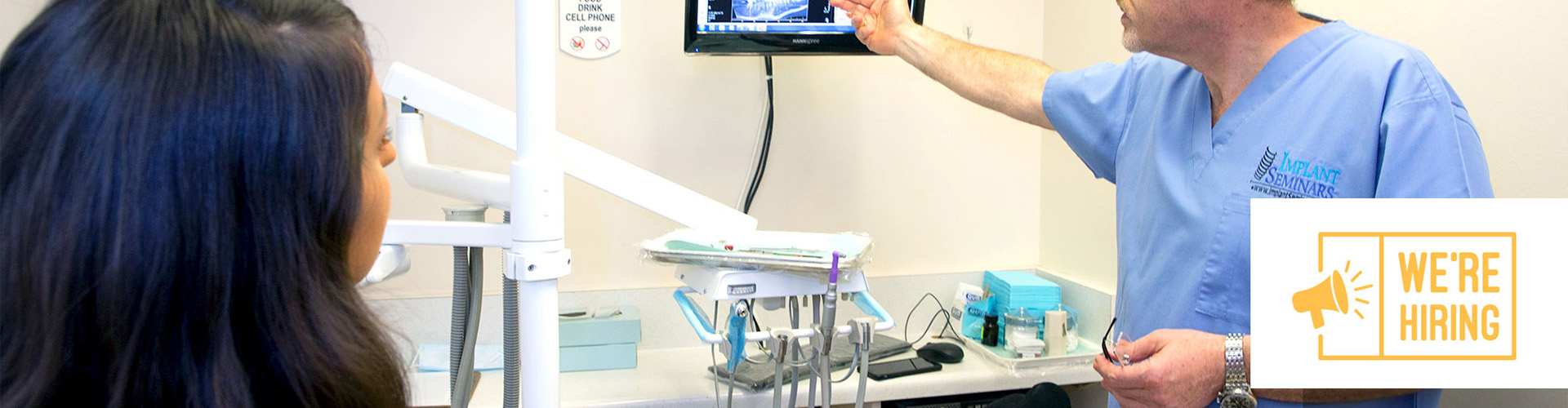 Female patient in office with male dentist.