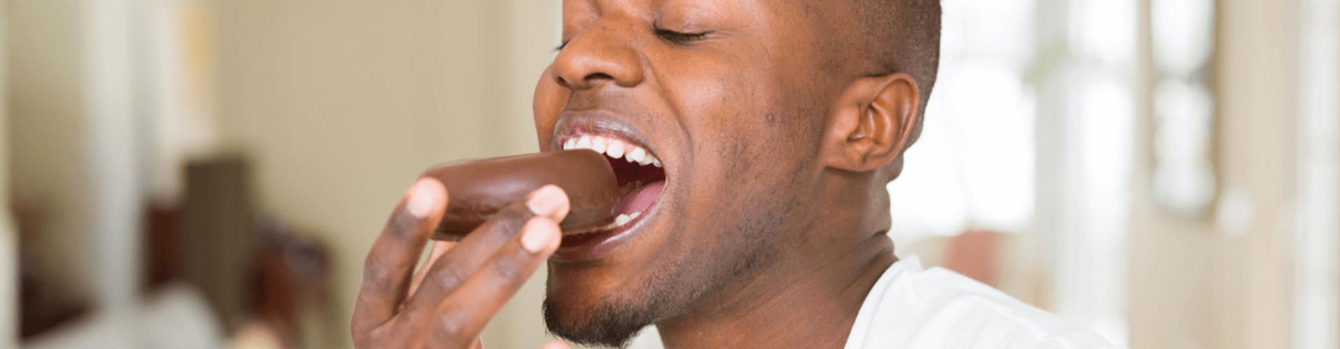 Man eating chocolate.