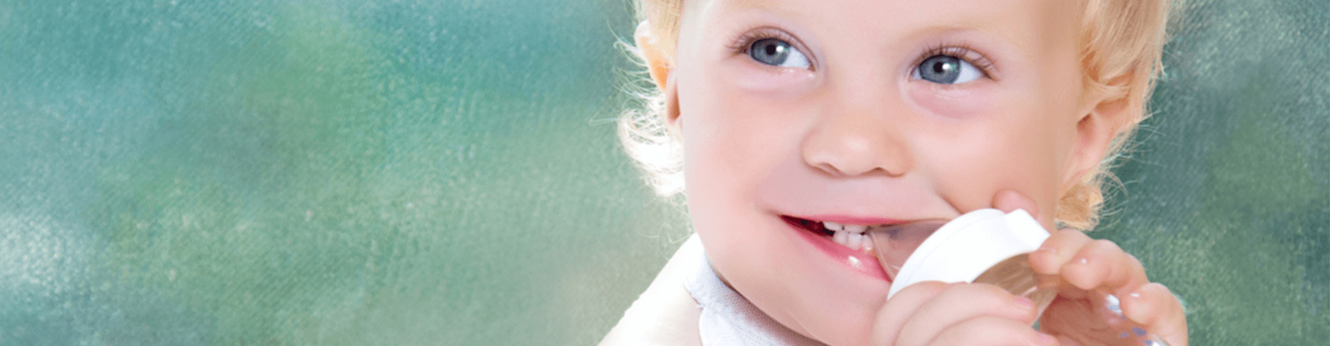 Baby drinking from a bottle.