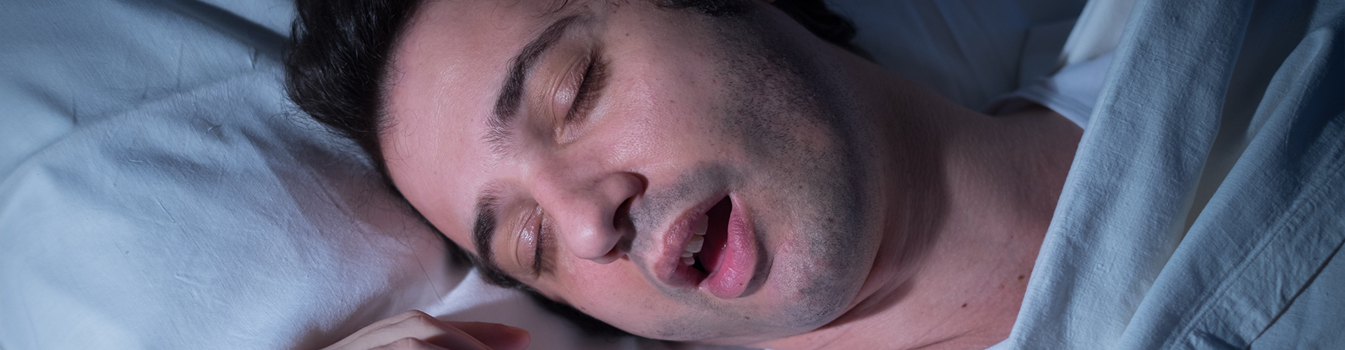 man sleeping with his mouth open
