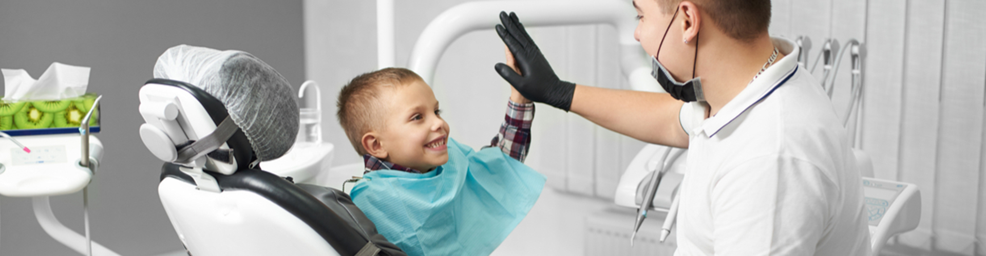 child giving the dentist a high-five
