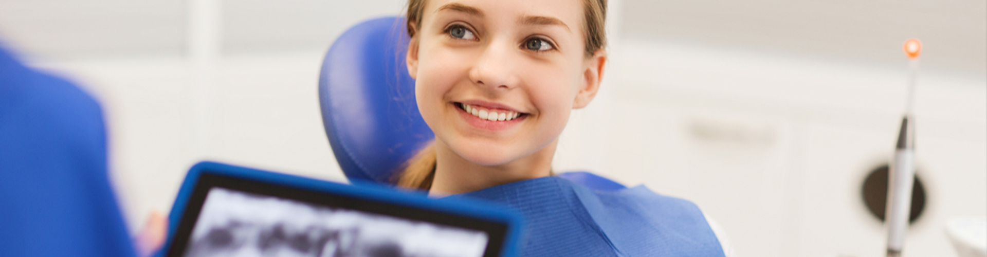 Doctor reviewing teeth x-rays with patient.
