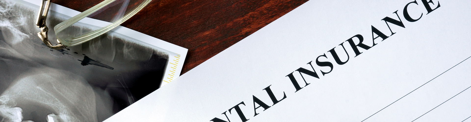 Dental insurance form and pen.