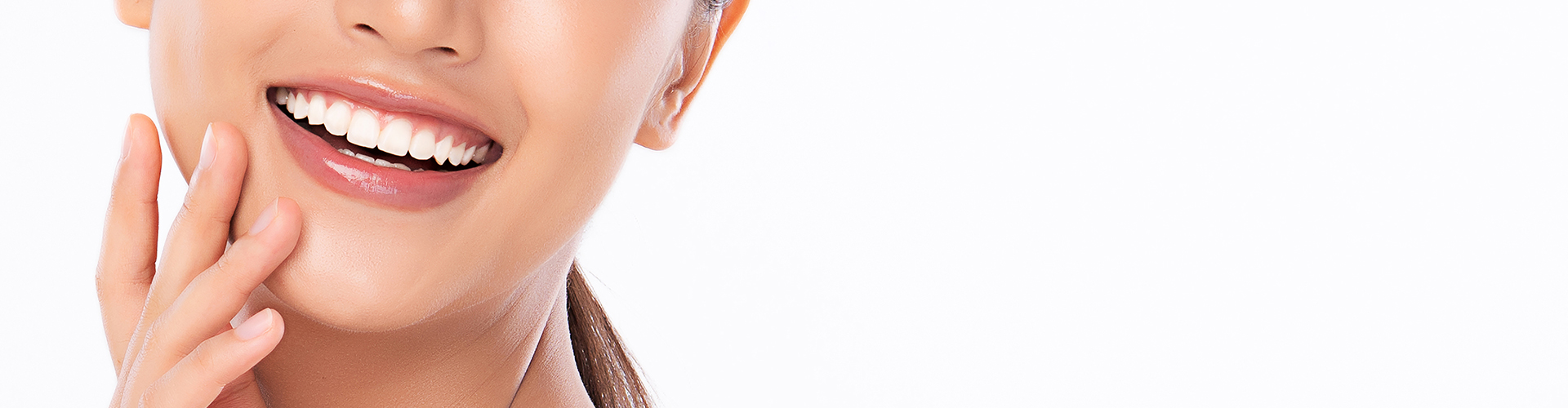 smiling woman with her hand by her cheek