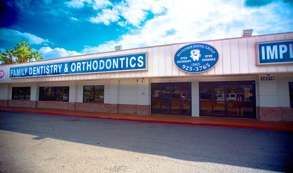 Exterior view of the building with the Bellflower Dental Group sign.