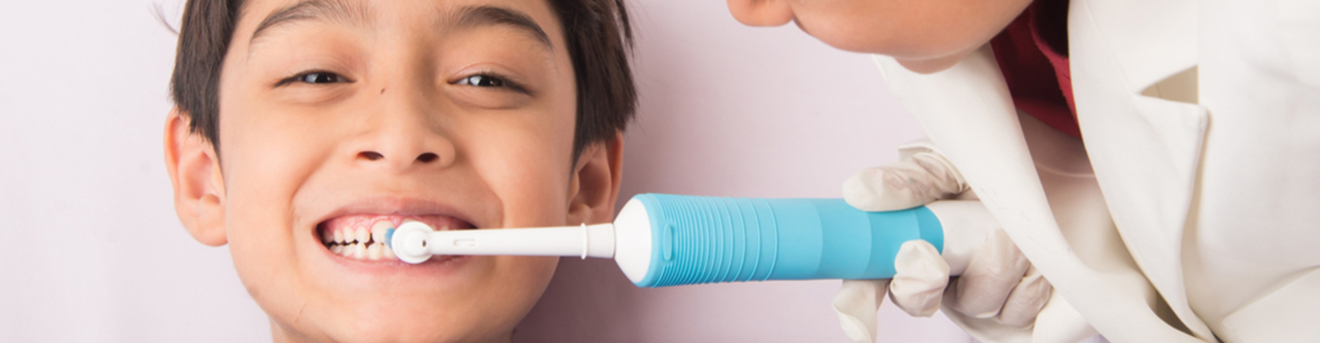 child getting his teeth brushed