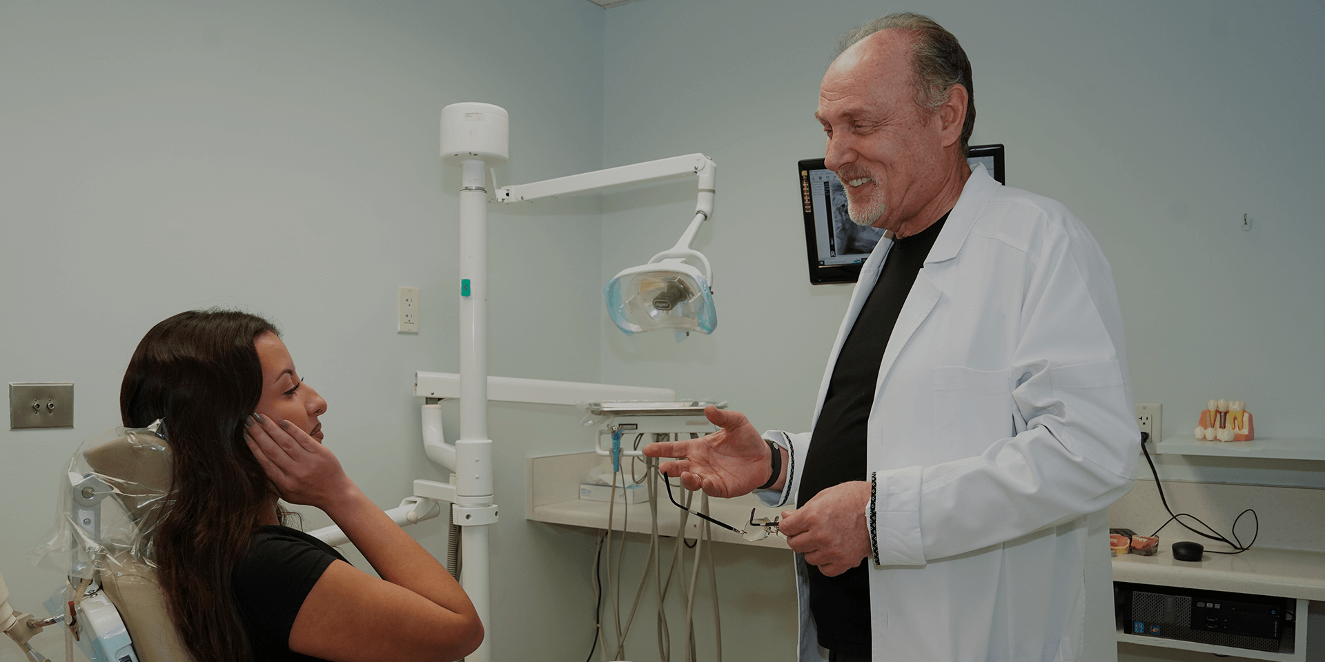 Dr. Tsibel with a patient.