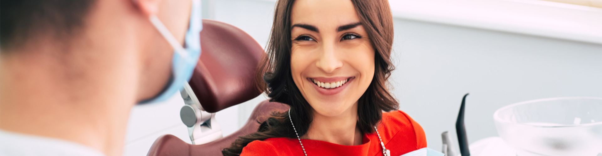 female smiling at dentist